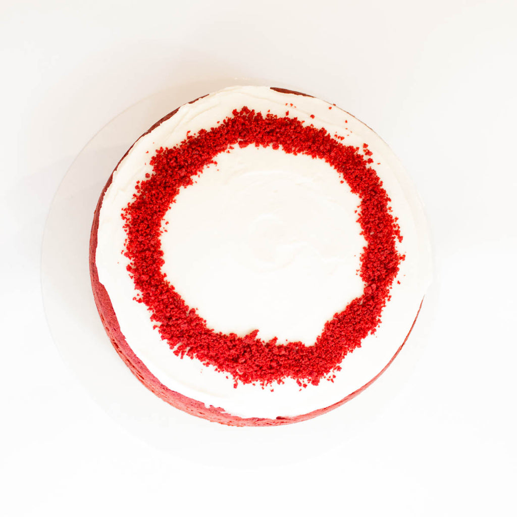 Red Velvet Cake with berries and creamy frosting