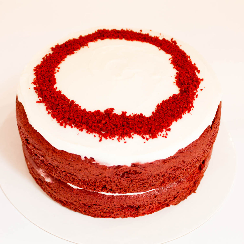 Red Velvet Cake with berries and creamy frosting