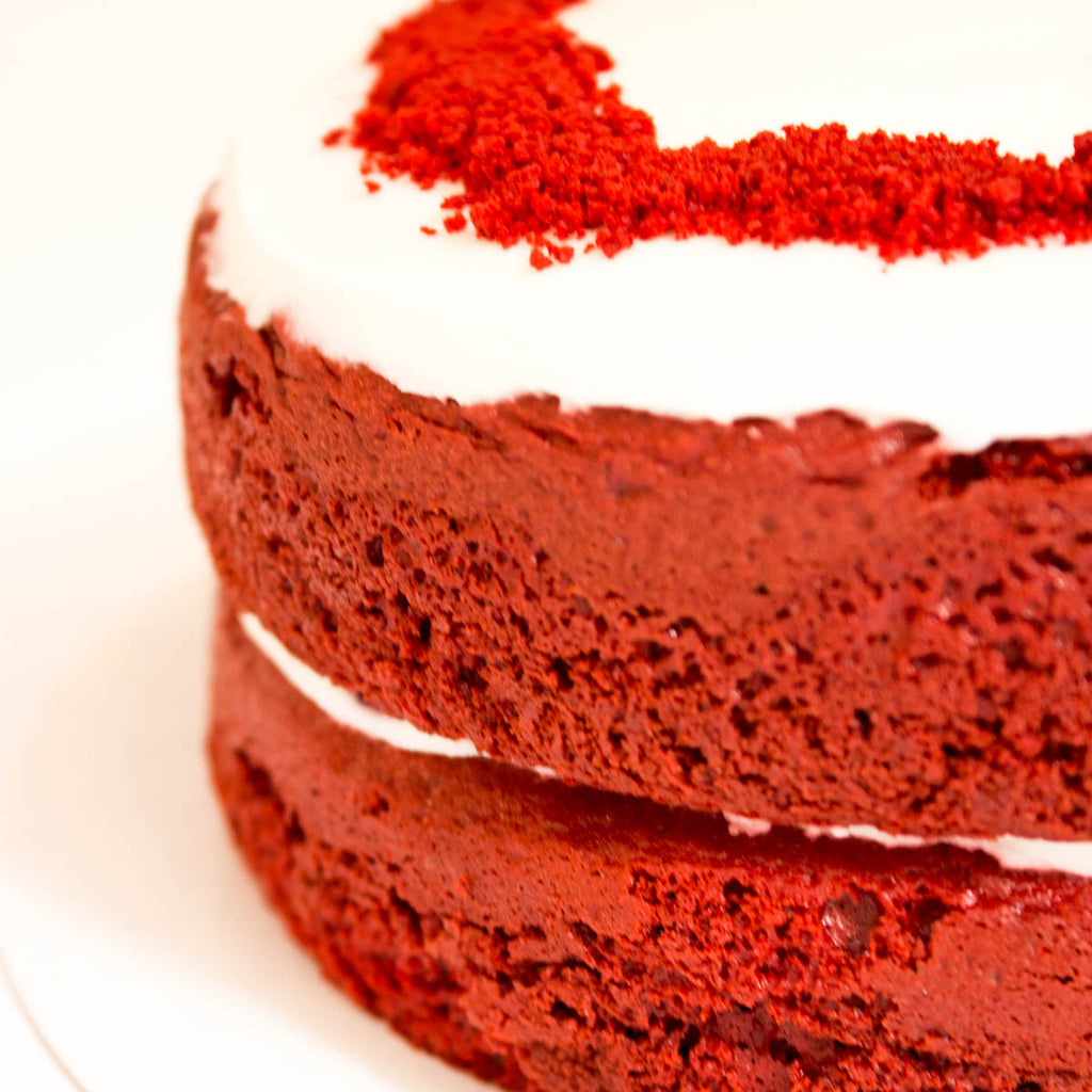 Red Velvet Cake with berries and creamy frosting